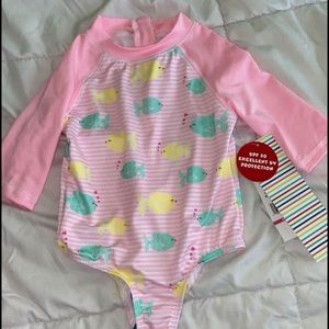 Brand new 12m long sleeve swimsuit